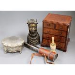 A miniature chest of drawers, a telescope, a Benin bust and plated box, and ivory seal and a