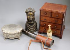 A miniature chest of drawers, a telescope, a Benin bust and plated box, and ivory seal and a