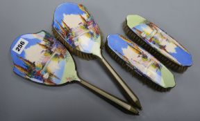 An enamelled four piece dressing table set