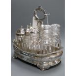 A Georgian composite silver eight-bottle cruet stand of shaped rectangular form, with wooden base,