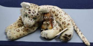 A Steiff reclining leopard with green glass eyes, circa 1940's and a small squirrel (lacking