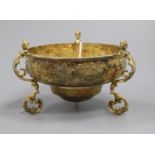 A George V silver gilt tri-handled floral embossed circular bowl by Daniel & John Welby, London,