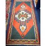 A Persian design runner 136 x 66cm