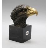 Milo. A bronze eagle head, on marble base, height 21.5cm