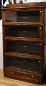 A Globe Wernicke serpentine mahogany four-section bookcase, c.1900, an early deluxe model, W.91cm