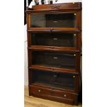 A Globe Wernicke serpentine mahogany four-section bookcase, c.1900, an early deluxe model, W.91cm