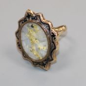 An early 20th century 9ct gold, quartz with iron pyrites and black enamel oval ring, size L.