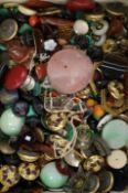 A large quantity of assorted buttons, hardstone and loose cut gemstones.