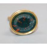 An early 20th century yellow metal and bloodstone set fob seal, 22mm.