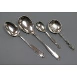 A Georg Jensen sterling silver spoon, two 1920's Danish white metal spoons and a Swedish white metal