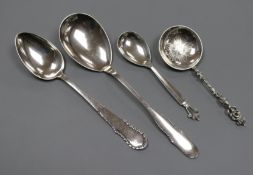 A Georg Jensen sterling silver spoon, two 1920's Danish white metal spoons and a Swedish white metal