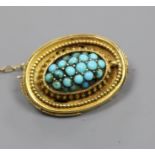 A Victorian yellow metal and turquoise set oval brooch, 23mm.
