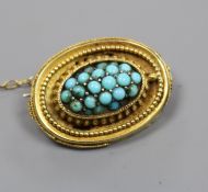 A Victorian yellow metal and turquoise set oval brooch, 23mm.