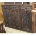 A carved oak sideboard, Art and Crafts style W.147.5cm