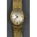 A lady's 18ct gold Certina manual wind wrist watch, on 18ct gold bracelet.