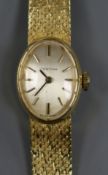 A lady's 18ct gold Certina manual wind wrist watch, on 18ct gold bracelet.