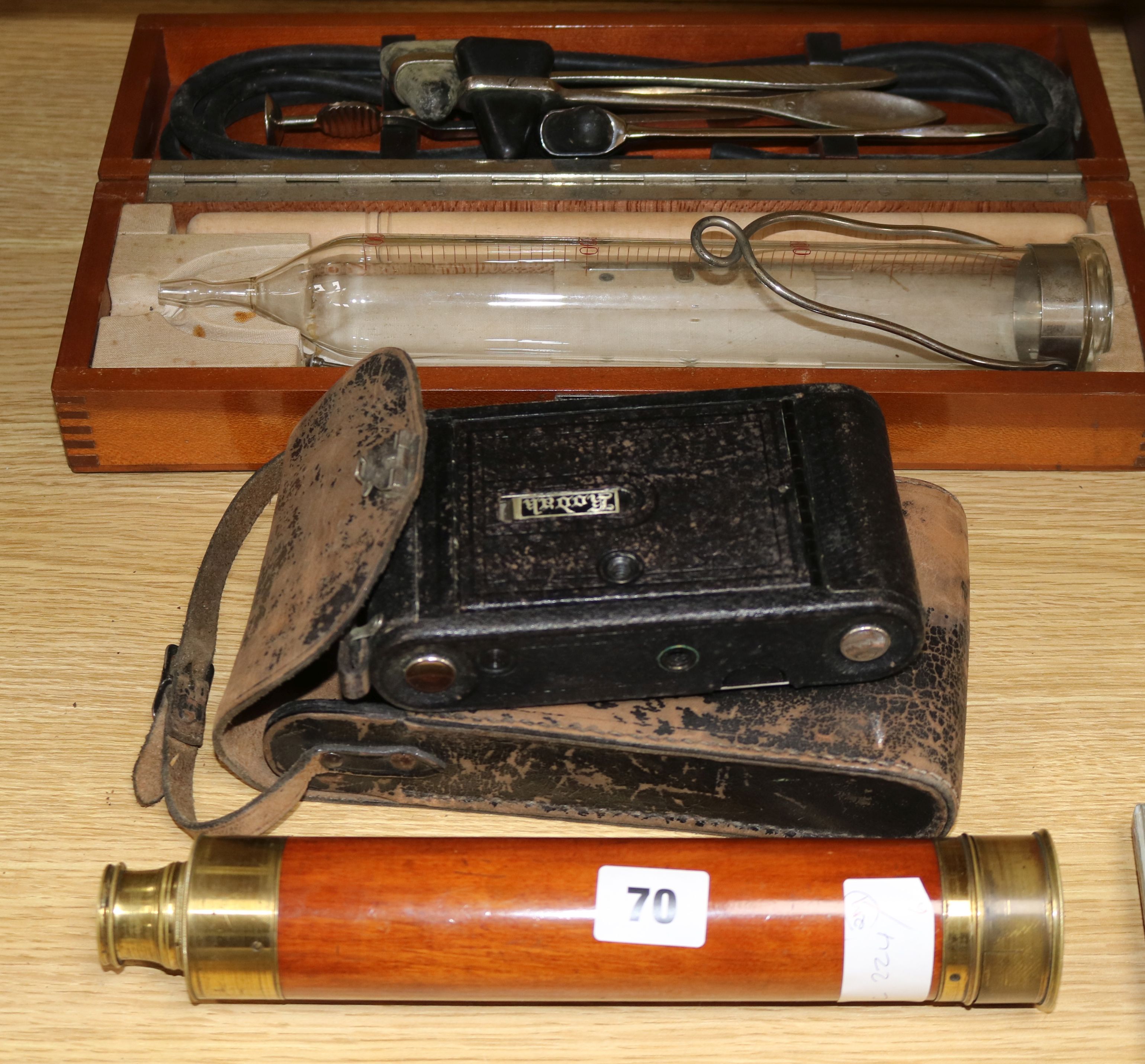 A Sheffield three drawer telescope, a Kodak camera and surgical instruments in a Chinese box