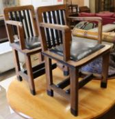 A pair of oak elbow chairs