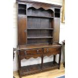 A mid 18th century oak dresser, with later upper section W.131cm