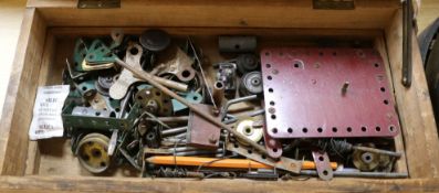 A collection of early Meccano including small parts tins, etc, in bespoke wooden box with two lift-