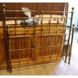 A brass framed bed W.145cm