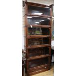 A Wernicke System Elastic serpentine mahogany six section bookcase, c.1895 stamped marks, this