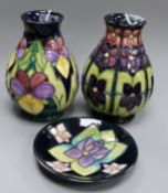 A Moorcroft 'Heartsease' pattern vase, 1994, H 14cm a 'Large Violets' pattern vase and a similar pin