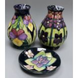 A Moorcroft 'Heartsease' pattern vase, 1994, H 14cm a 'Large Violets' pattern vase and a similar pin