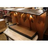 An illuminated palm tree glass top console table W.151cm