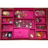 A quantity of costume jewellery and watches.