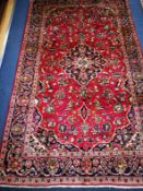 A Kashan carpet 240 x 143cm
