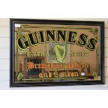 A Guinness advertising mirror W.94cm