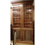 A George III style mahogany bookcase W.141cm