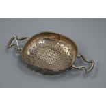 A late 18th century unmarked white metal lemon strainer, 20.8cm.