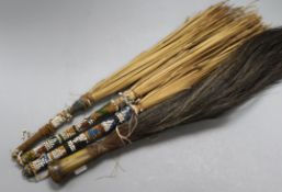 Four African fly whisks