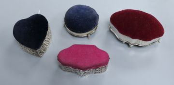 Four various silver-mounted trinket boxes with pin cushion tops, including a Victorian heart-