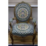 A Louis XV style giltwood fauteuil