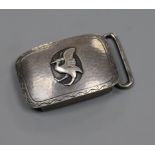 A Georg Jensen planished white metal belt buckle decorated with a bird, no. 52A, 45mm.