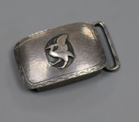 A Georg Jensen planished white metal belt buckle decorated with a bird, no. 52A, 45mm.