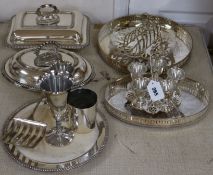 A group of plated wares, the egg cruet stand with silver spoons
