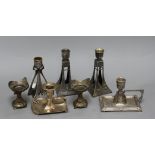 A pair of squat Secessionist candlesticks, two candle holders and three others, the majority WMF