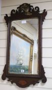 A mahogany fret cut shell inlaid wall mirror W.51cm