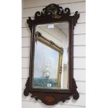 A mahogany fret cut shell inlaid wall mirror W.51cm