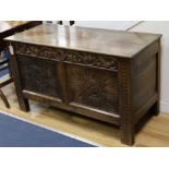 A 17th century style carved oak coffer W.114cm