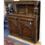 A 17th century style carved oak court cupboard W.141cm