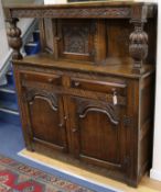 A 17th century style carved oak court cupboard W.141cm