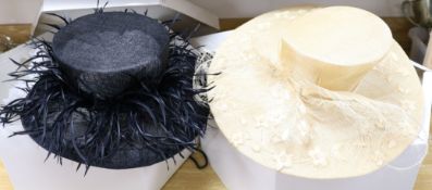 Two Lock & Co., London ladies' designer hats in original boxes, one black, one straw-coloured