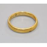 A 22ct gold wedding band.