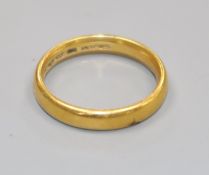 A 22ct gold wedding band.