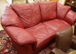 A red leather settee W.220cm